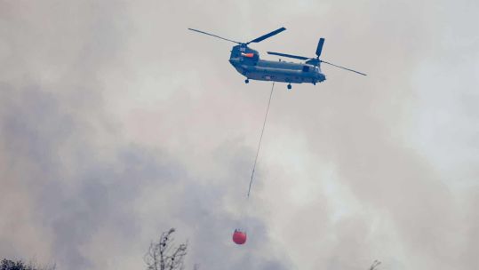 A RAF Chinook helicopter helps fight wildfires in Cyprus