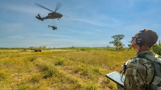 The unnamed sergeant in the US Army National Guard controls the helicopter with his tablet