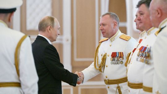 Vladimir Putin met Russian naval officers at the admiralty building in St Petersburg as part of the scaled-back Navy Day celebrations