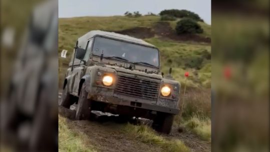 A Land Rover tackles a section on one of the challenging courses