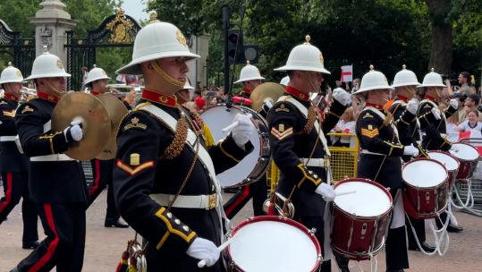 The Band of His Majesty’s Royal Marines Portsmouth led the open-top bus procession down the Mall