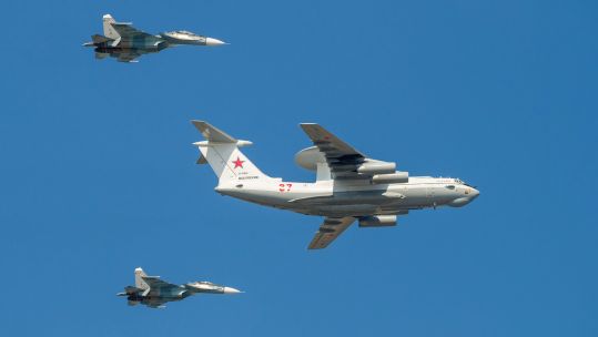 Aircraft A-50 Liska, accompanied by two Su-30SM multirole fighters. Fragment of a military parade