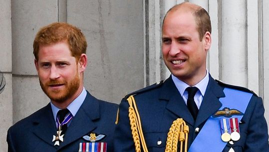 2GXBTM5 Prince Harry and Prince William stand on the balcony of Buckingham Palace in London to watch the flypast to mark the centenary of the RAF 100718 CREDIT Anwar Hussein Alamy 110823