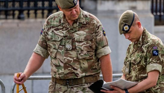 Senior Guards Warrant Officers measure out the area, with pace sticks, in advance of the State Funeral for Queen Elizabeth