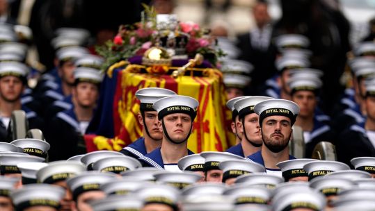 The coffin of Queen Elizabeth II is carried in to Westminster Abbey during State Funeral 