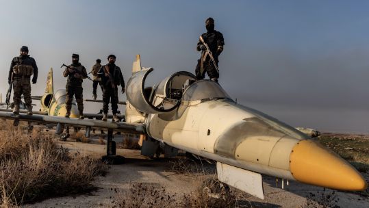 2YRJD37 Members of the armed Syrian opposition on a military plane after taking control of the Nayrab military airport in the city of Aleppo NOT FOR REUSE 061224 CREDIT Alamy