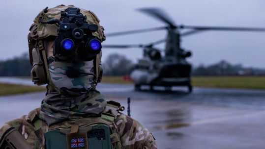 A special operations soldier from 4th Battalion, The Ranger Regiment works with a Chinook at RAF Leeming during the two-week Exercise Hyperion Storm