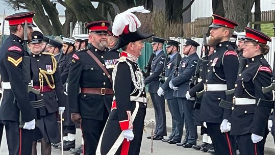 New Governor Colin Martin-Reynolds  inspects the personnel formed up on parade