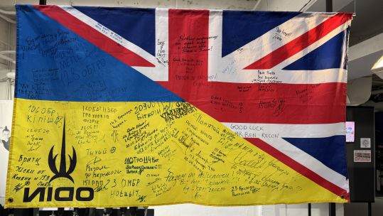 Among the items on display is a flag from the training of Ukrainian soldiers in the UK - more than 56,000 have participated in such training under Operation Interflex