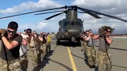 RAF Akrotiri personnel pulled the Chinook 1,310 feet for the veterans charity (Picture: MOD)