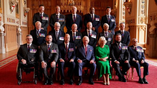 3B55M5D King Charles and Queen Camilla pose for a photo during a reception for the Victoria Cross and George Cross Association at Windsor Castle 010525 CREDIT Alamy