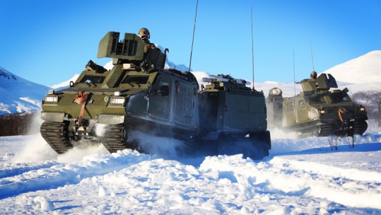 Viking Vehicles move through deep snow around Bardufoss exercise areas during Ex Cold Enabler 2018 in Norway.