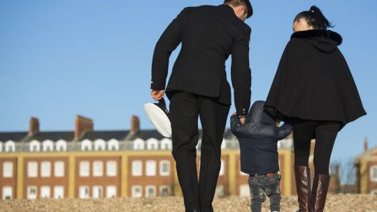 Royal Navy RNSPT and his wife and child walking on Portsmouth Beach.	UK MOD © Crown copyright 2019 