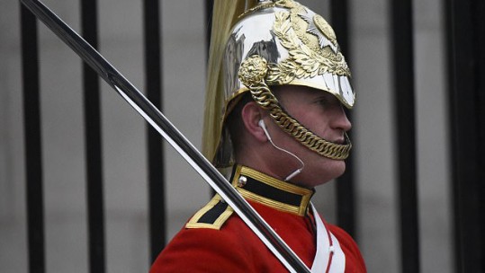 Soldier wearing headphones on Horse Guards Parade