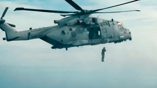 A marine from 42 commando makes a leap into the sea