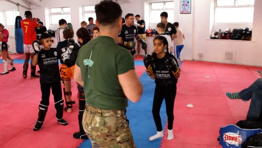 A Royal Marines commando helping deliver a martial arts session in Leeds to combat knife crime 190125 CREDIT BFBS