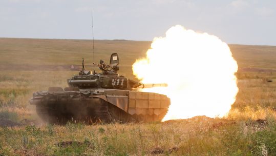 A Russian T-72B3 battle tank firing during an operational readiness check at Kadamovsky range in the Rostov on Don region 