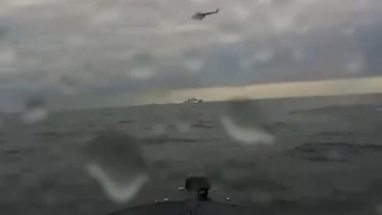 A Russian helicopter believed to be trying to shoot a Ukrainian drone out of the water (Picture: Ukraine MOD).