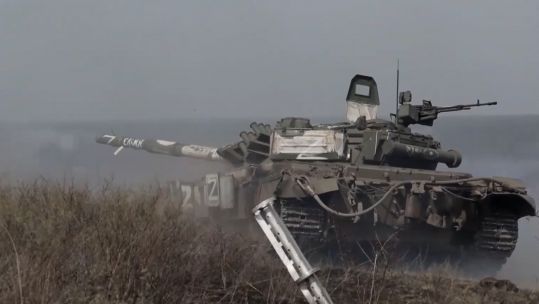 A Russian tank rumbles through terrain amid concerns of a Russian offensive in Donbas (Picture: Russian MOD).