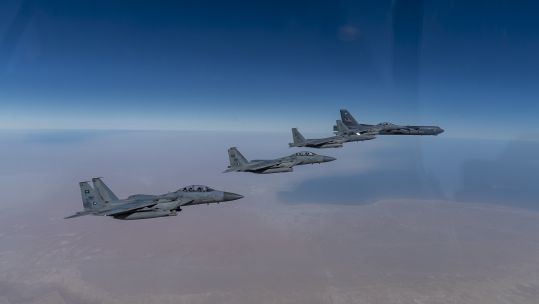 A US Air Force B-52 Stratofortress aircraft flies with Royal Saudi Arabian Air Force F-15SA fighter jets as part of a bomber task mission in the Middle East (Picture: US Air Force).