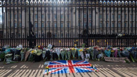 A Union flag and flowers outside Buckingham Palace after the death of Prince Philip