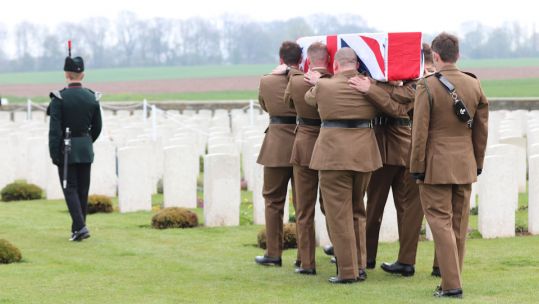 A bugler and bearer party from1 RIFLES carry Private Burt’s to the graveside 150419 CREDIT Crown Copyright.jpg