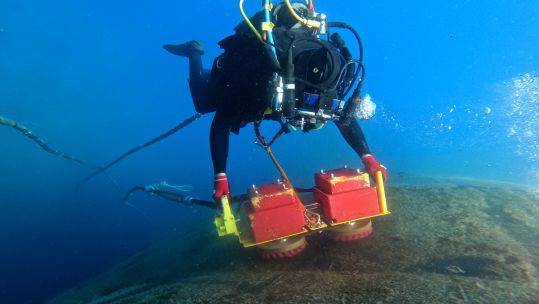 A diver cleans the hull of HMS Audacious in Souda Bay Crete (Picture: Royal Navy).