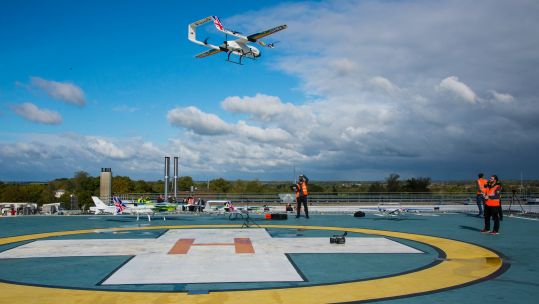 A drone, set to be flown by former RAF and Royal Navy pilots to deliver COVID tests and equipment, being flown
