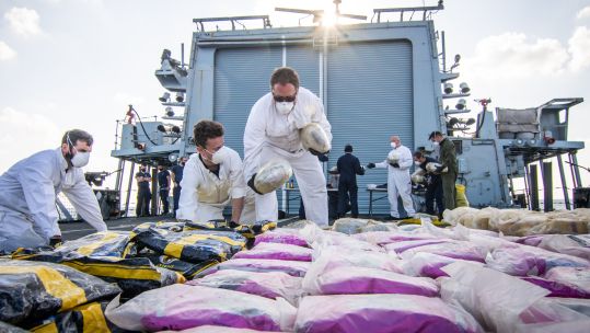 A drugs haul is laid out on Montrose's flight deck CREDIT Royal Navy