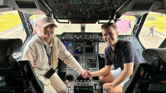 A happy couple after a succesful wedding proposal in the cockpit of a RAF Atlas at RIAT