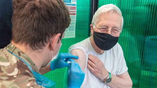 A member of the public receives the Pfizer Covid-19 vaccination from a Royal Army Medical Corps (RAMC) doctor at a mass vaccination site in York on 20 January 2021 (Picture: MOD).
