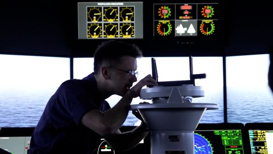 A naval cadet uses a simulator at BRNC Dartmouth to train warfare skills.