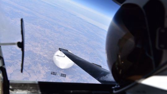 A pilot of a US U-2 spy plane takes a selfie from his cockpit with a Chinese surveillance balloon in the background (Picture: US Department of Defense).