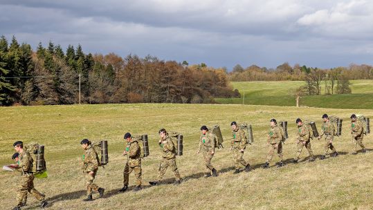 A recruit leads fellow trainees from HMS Collingwood through the Wiltshire countryside during Exercise Hidden Dragon DATE UNKNOWN CREDIT ROYAL NAVY .jpg