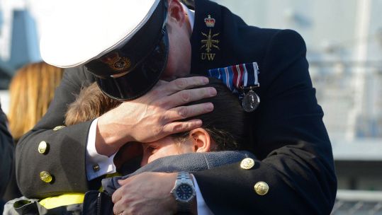 A Chief Petty Officer from HMS Richmond, is reunited with his family after a deployment at sea in 2014 CREDIT Crown Copyright