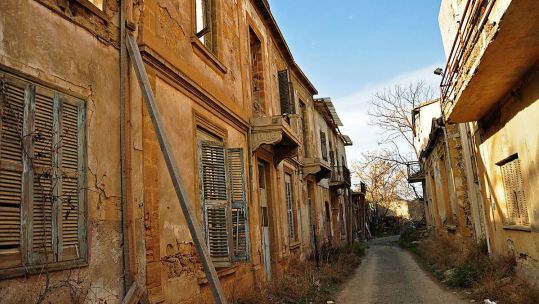 A photo of Nicosia's Buffer Zone, which shows abandoned, shot up buildings left empty when the 'Green line' was drawn CREDIT Crown Copyright