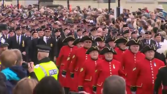 Young and old parade for Armed Forces Day