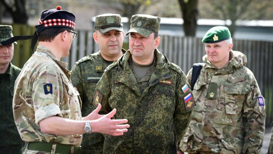 Colonel Charlie Wallace (left) giving Russian personnel a guided tour of the facility at Stirling