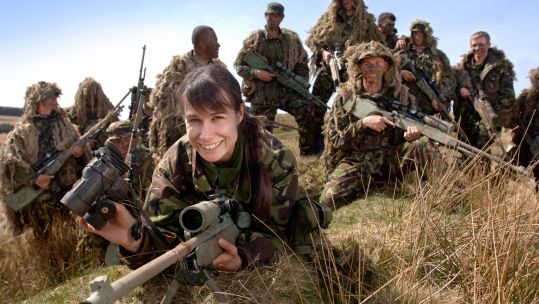 A BRITISH ARMY FEMALE RECRUIT AT A FIRING RANGE IN BRECON WALES DURING A SNIPER TRAINING COURSE