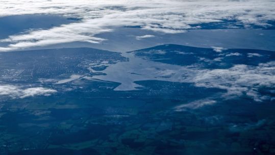 Aerial of Portsmouth Harbour on the left, Gosport on the right and Isle of Wight at the top
