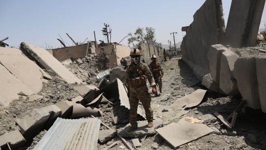 Afghan security force members inspect at the site of an explosion in Kabul, Afghanistan 070819 CREDIT PA