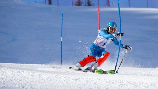 Cover Image: An RAF Alpine skier takes on the Alpine Super Combined Slalom (Picture: Crown Copyright).