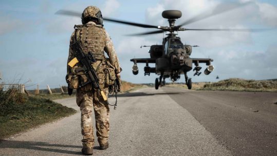 An Arming Loading point Commander guides an Apache AH64-E pilot into land 26102022 CREDIT MOD Crown Copyright.jpg