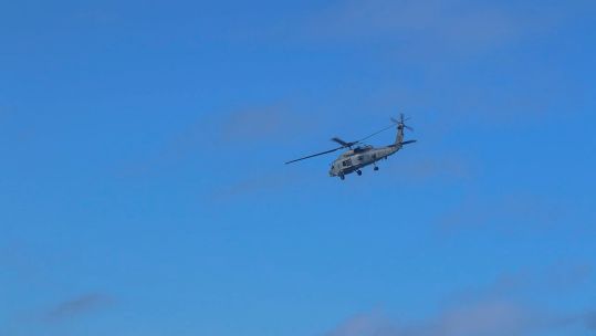 An MH-60R 'Romeo' helicopter from HMAS Brisbane conducts search and rescue operations in the vicinity of Lindeman Island, Queensland, 29 July 2023 29072023 credit Australian Department of Defence.jpg