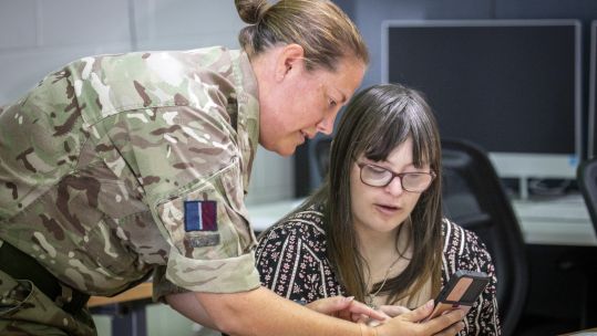 An RAF aviator speaks to a student in Darwin Australia (Picture: RAF).