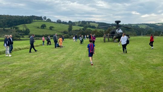 Members of the public getting up close to the Apache helicopter in Caton after it made an emergency landing (Picture: RNPedro87 X).