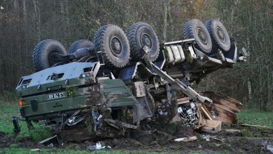 An overturned military vehicle sits in the middle of the Keir roundabout on the A9 near Dunblane after an accident there