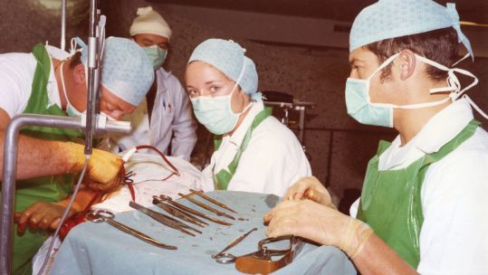 Here, junior doctor Dr Susie West operates on a military patient on SS Canberra in 1982 (Picture: Dr Susie West).