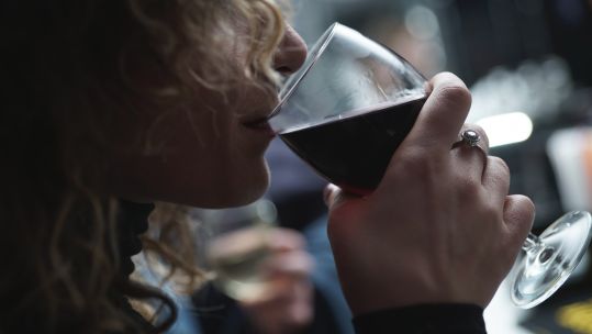 Anonymous - Bringe drinking - Woman drinking a glass of red wine CREDIT Alfonso Scarpa SOURCE Unsplash