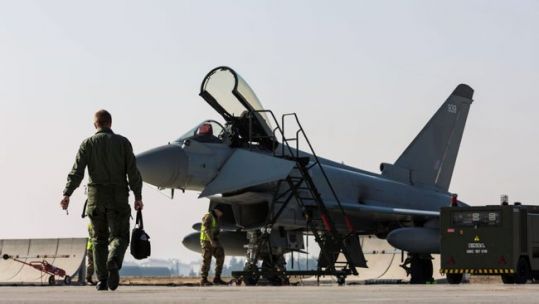 Anonymous RAF Pilot walks out to a Typhoon FGR4 to prepare for take off with 4 F16s from Konya Air Base 171120 CREDIT MOD